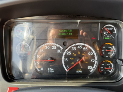 Dashboard of a Freightliner M2-106 showing instrument cluster with speedometer, tachometer, and odometer reading 238,847.1 miles.
