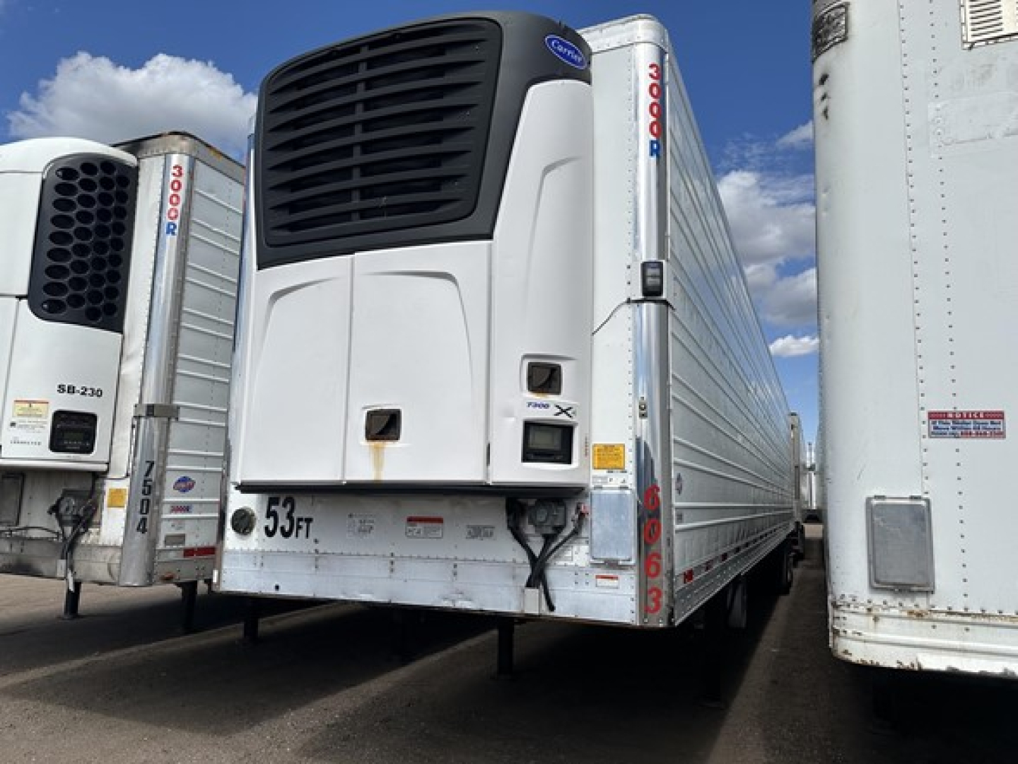 Utility 3000R reefer trailer with rear door and refrigeration unit visible; markings include '3000R' on side posts, '53 Ft' on bottom front, and a black refrigeration unit grille.