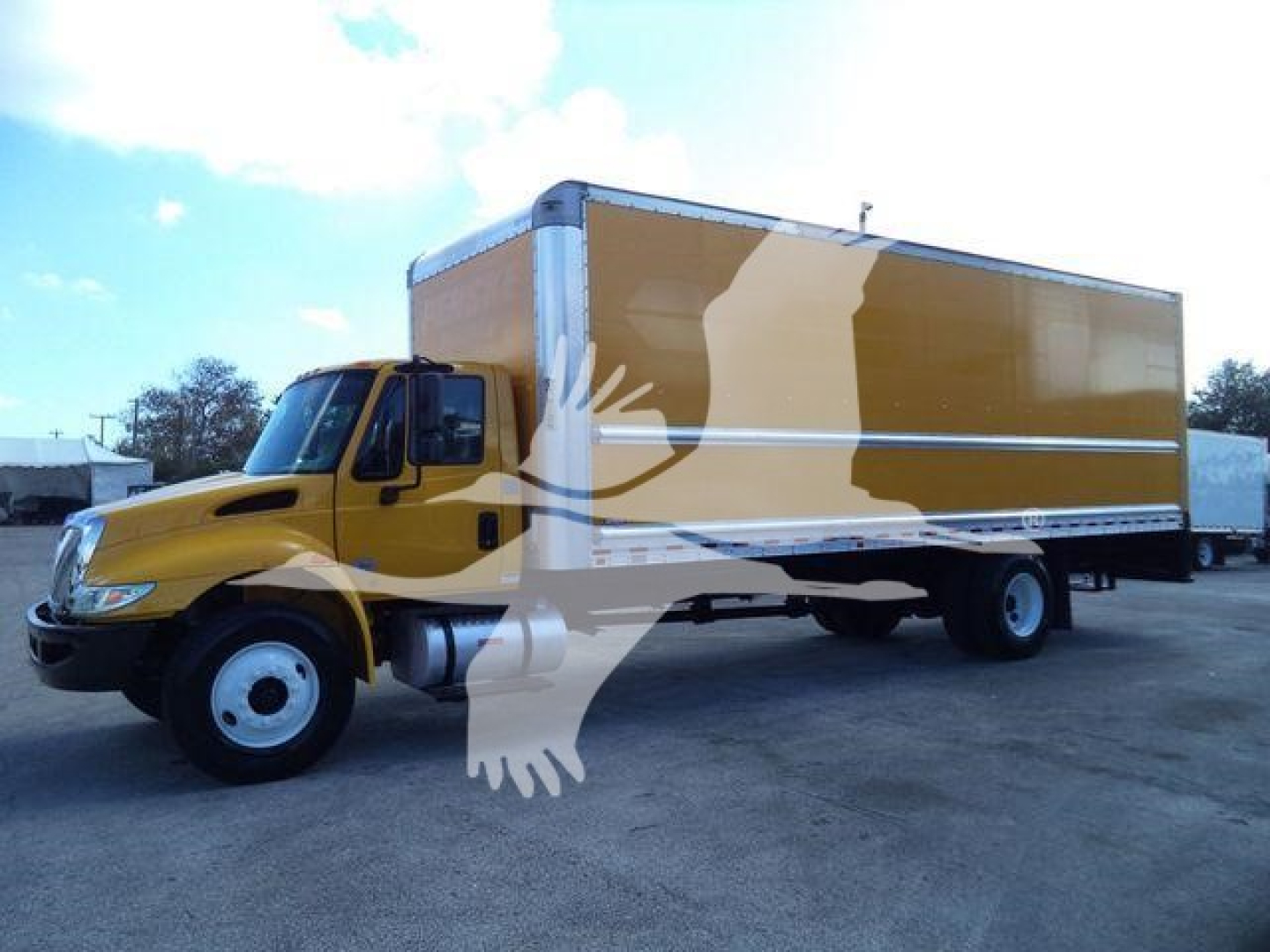 Box truck with yellow cab and large brown box body showing stock number T15107 P and category Box.