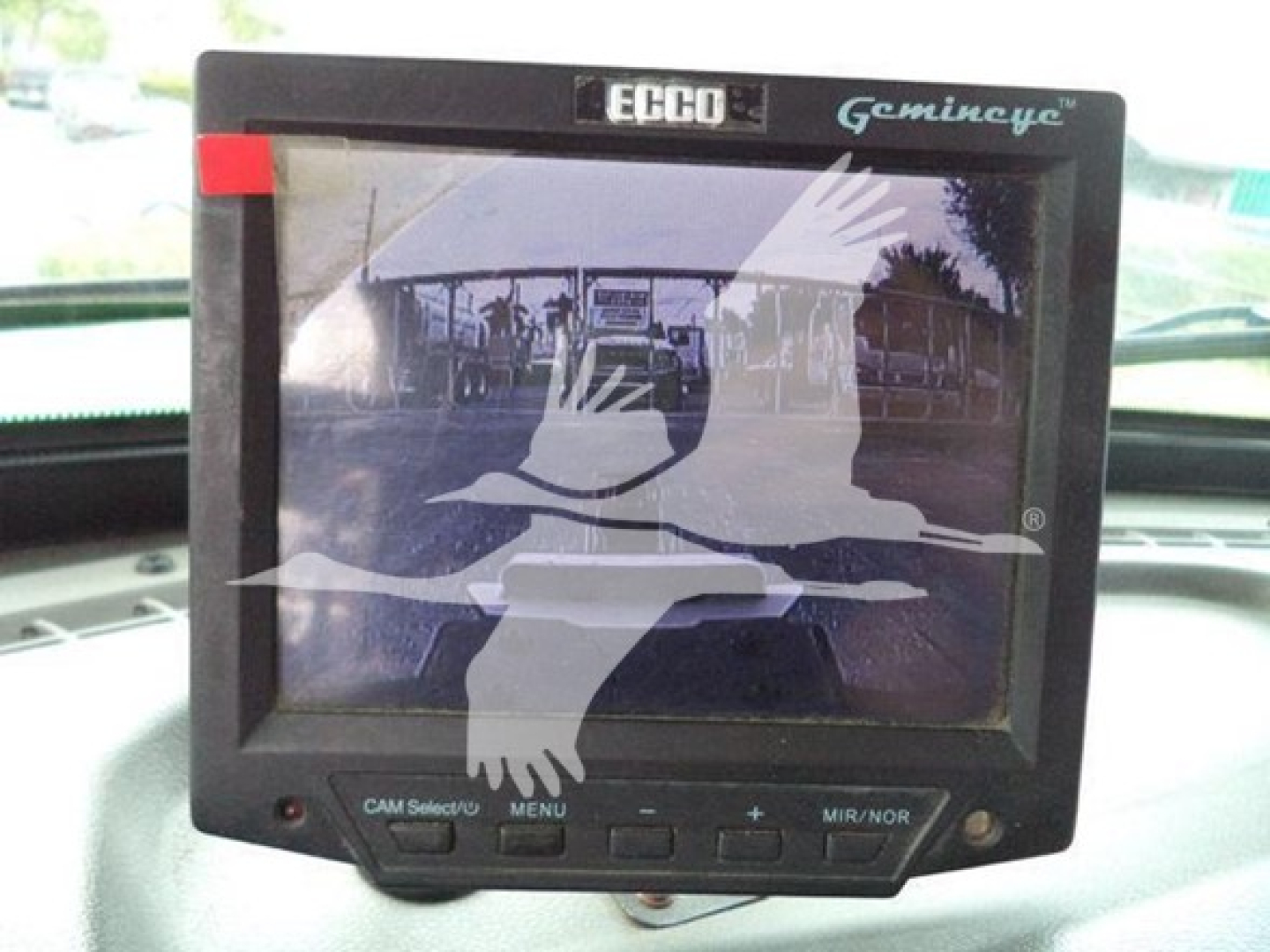Peterbilt 348 dash screen showing Ecco Gminceye monitor with bird logo and controls on bottom