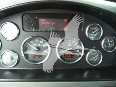 Peterbilt dashboard cluster showing multiple gauges and a digital display with 'No Warnings' text.