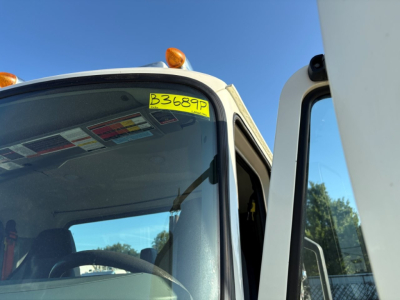 Front cab of a 2020 Mack PI64T truck showing a yellow stock sticker B3689P on the windshield and interior dashboard visible.