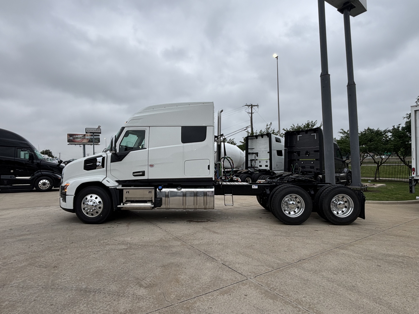New 2027 Mack PR64T76M conventional sleeper truck in side profile view showing cab, tandem axles, and chassis.