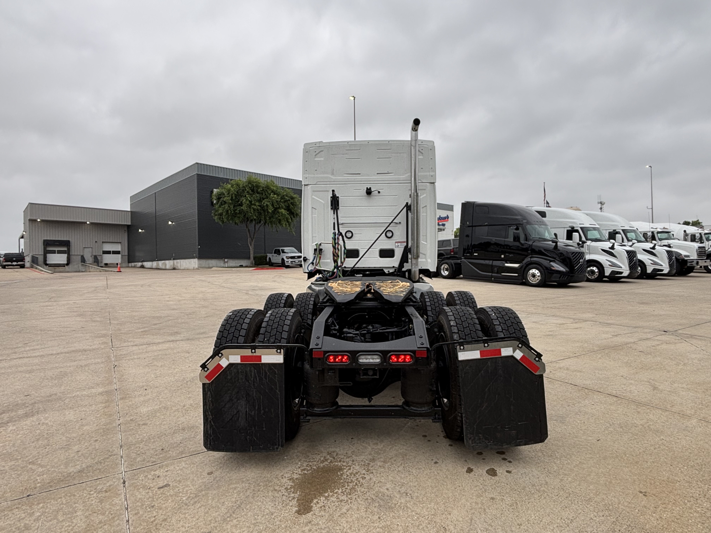 Mack PR64T76M tractor bare chassis rear view showing dual rear axles and fifth wheel area with fifth wheel connection plate.