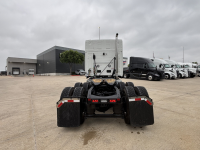 Mack PR64T76M tractor bare chassis rear view showing dual rear axles and fifth wheel area with fifth wheel connection plate.