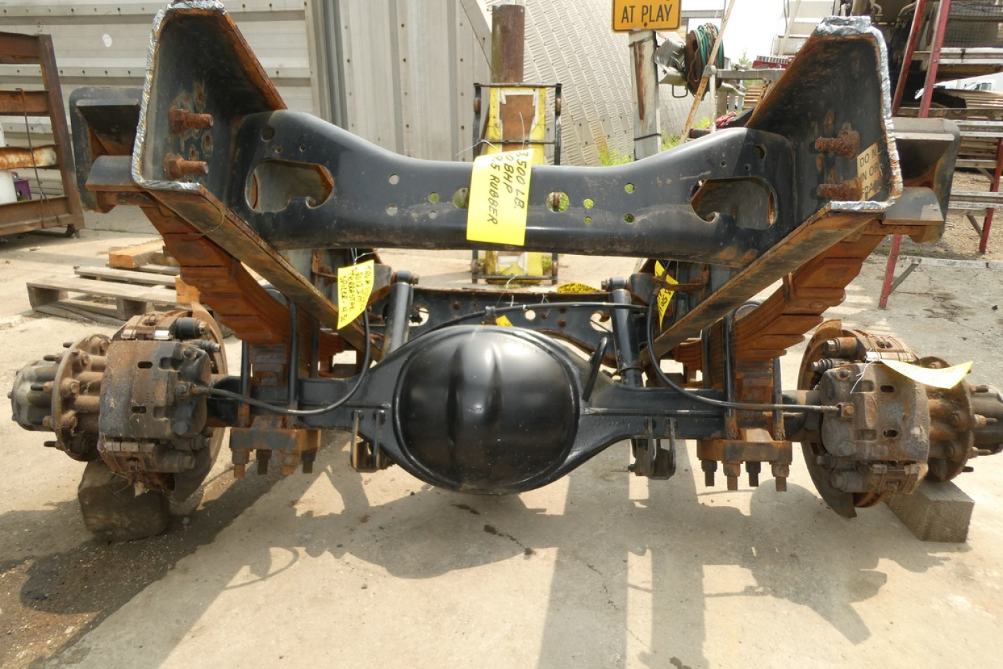Rear axle and suspension of a 2012 International TERRASTAR cab chassis showing differential and axle housings.