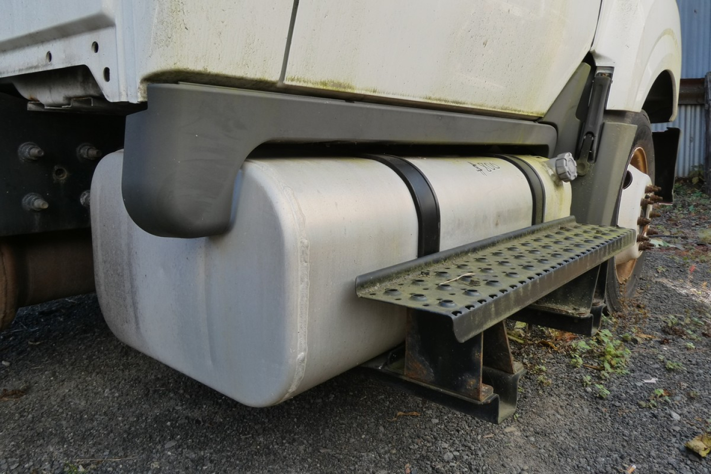 Truck side view showing fuel tank and step, cab and chassis underbody detail
