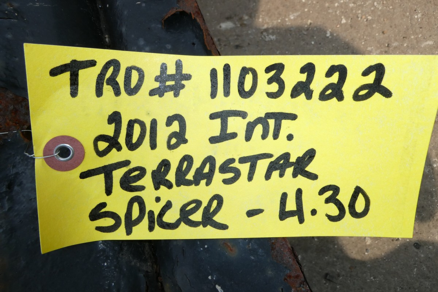 Tag on a yellow label with handwritten black text: 'TRO# 1103222 2012 Int. TERRASTAR Spicer - 4:30'
