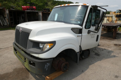 2012 International TERRASTAR cab and chassis truck with front bumper and missing front wheel; VIN 1HTJSSKK0CJ407696 visible on windshield; stock number 1103222 not visible in image.