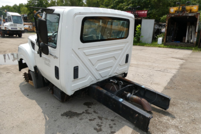 International Terrastar cab and chassis rear view showing white body and chassis with dual rear mounts, rear window, and door text.