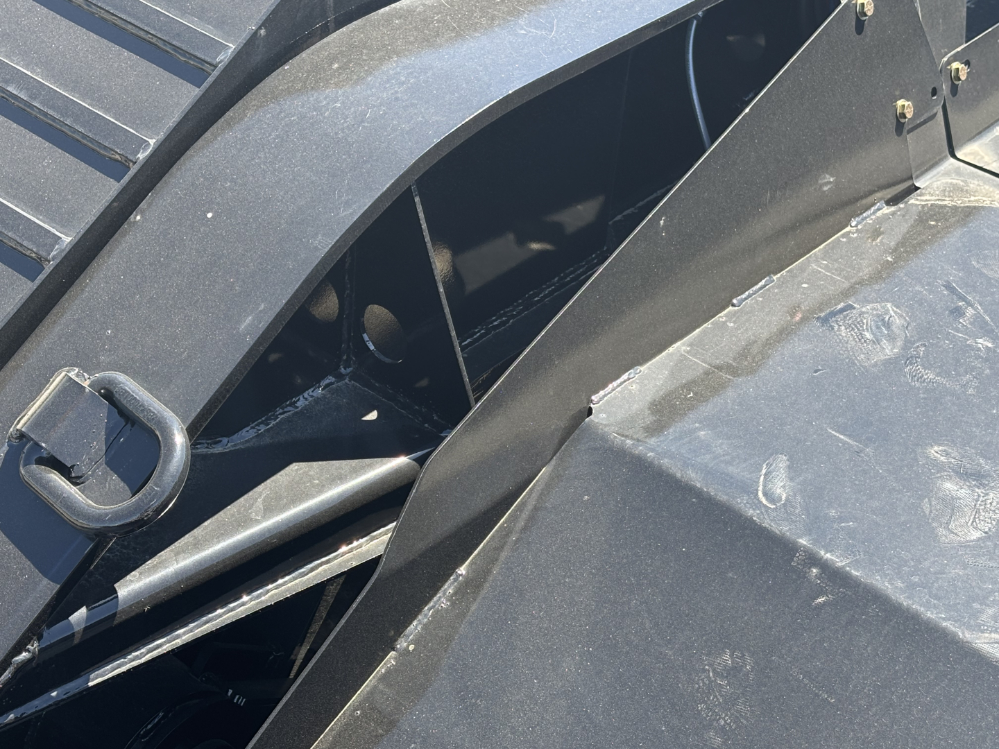 Load King trailer showing structural frame and deck components in close-up view.