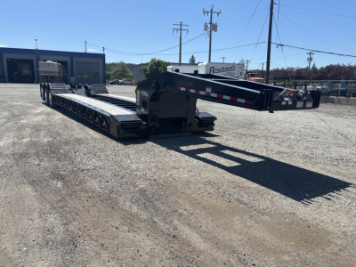 Load King lowboy trailer in outdoor lot showing 9' x 24' dual gooseneck configuration and extended deck sections.