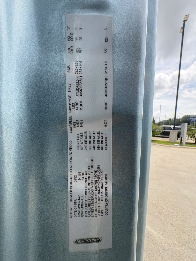Label on Freightliner truck door with vehicle weights and axle ratings; shows 'Gros Vehicle Weight', 'GAWR', 'Gross Axle Weight Rating' values and various numbers in small print.