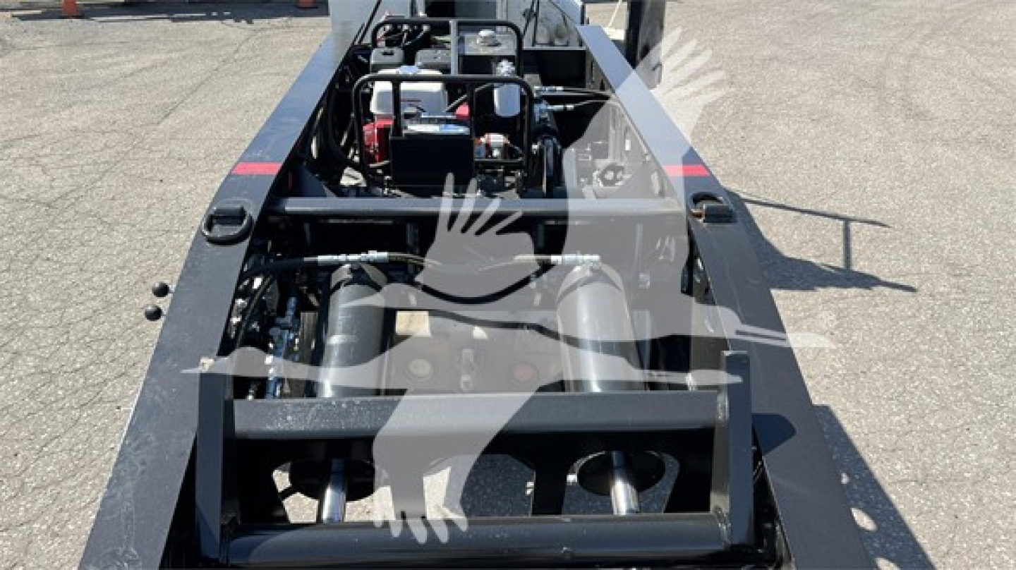 Trailer underside view showing hydraulic components and frames of a Fontaine Renegade Xn20 lowboy trailer.
