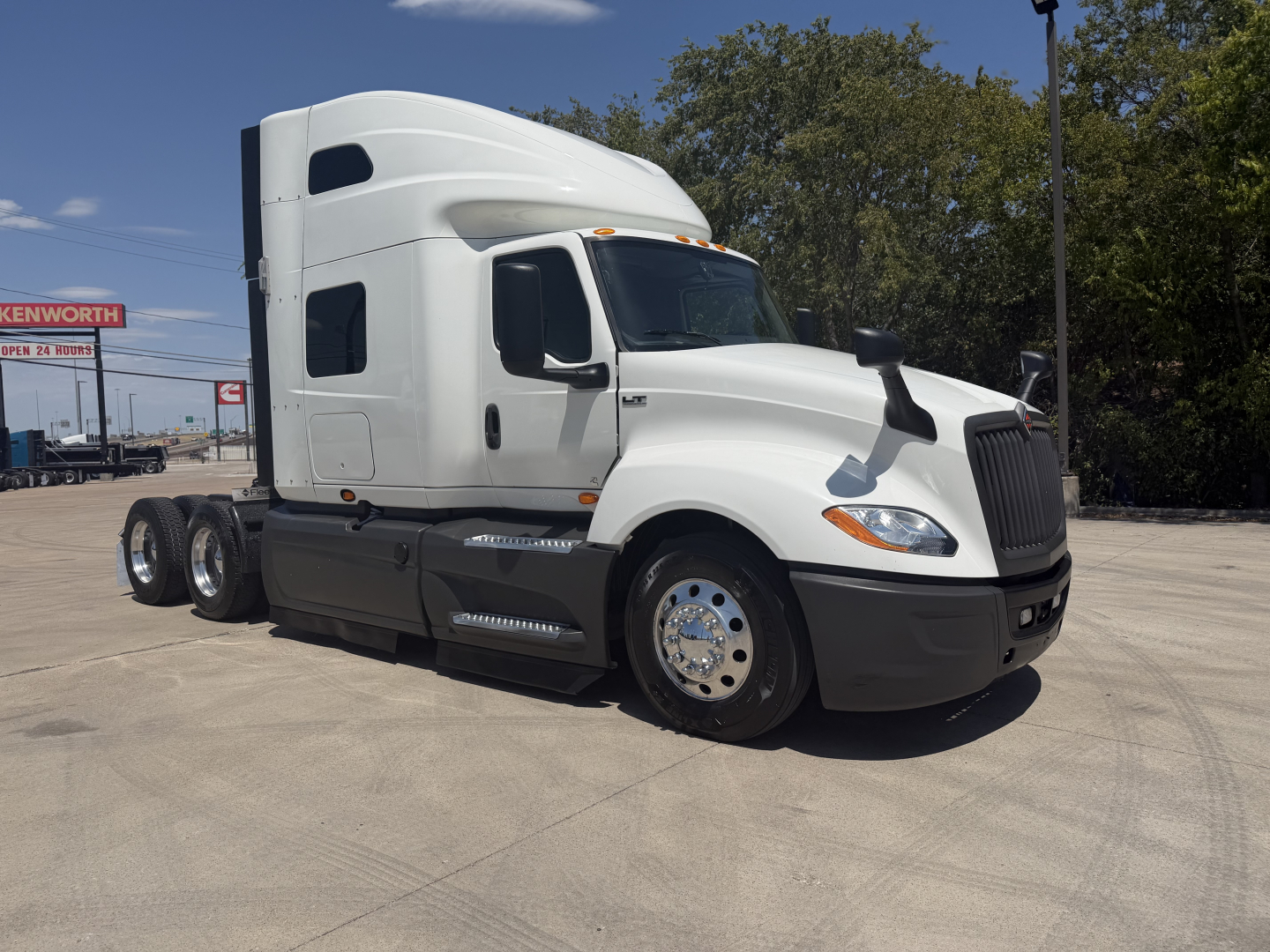 International LT Series truck cab and chassis side view showing sleeper cab and wheel rims.
