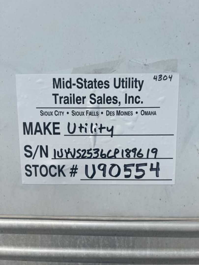 Mid-States Utility Trailer Sales, Inc. label showing MAKE Utility, S/N 1UYVS2536CP189619, STOCK # U90554 on a van.