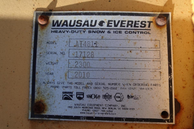 Dash plate on Mack GU Granite showing model AT481 with serial number 17128 and weight 2300, year 2010, Wausau Everest plate.