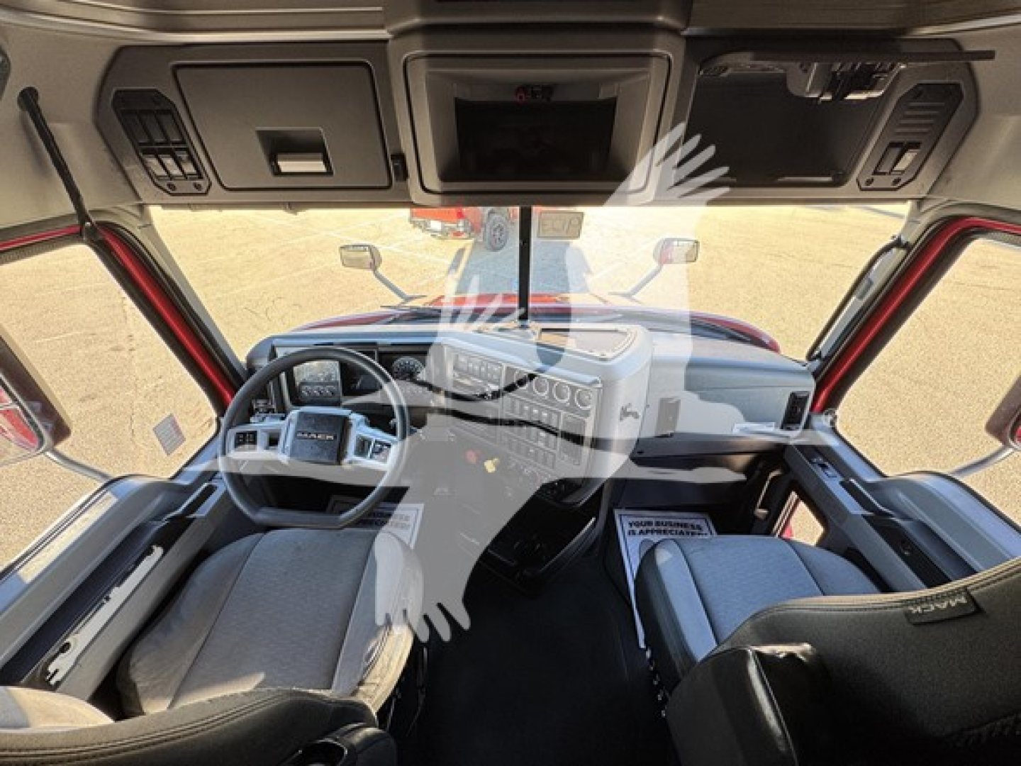 Truck cab interior of a 2019 Mack Anthem 64T showing steering wheel, dashboard, and surrounding controls.