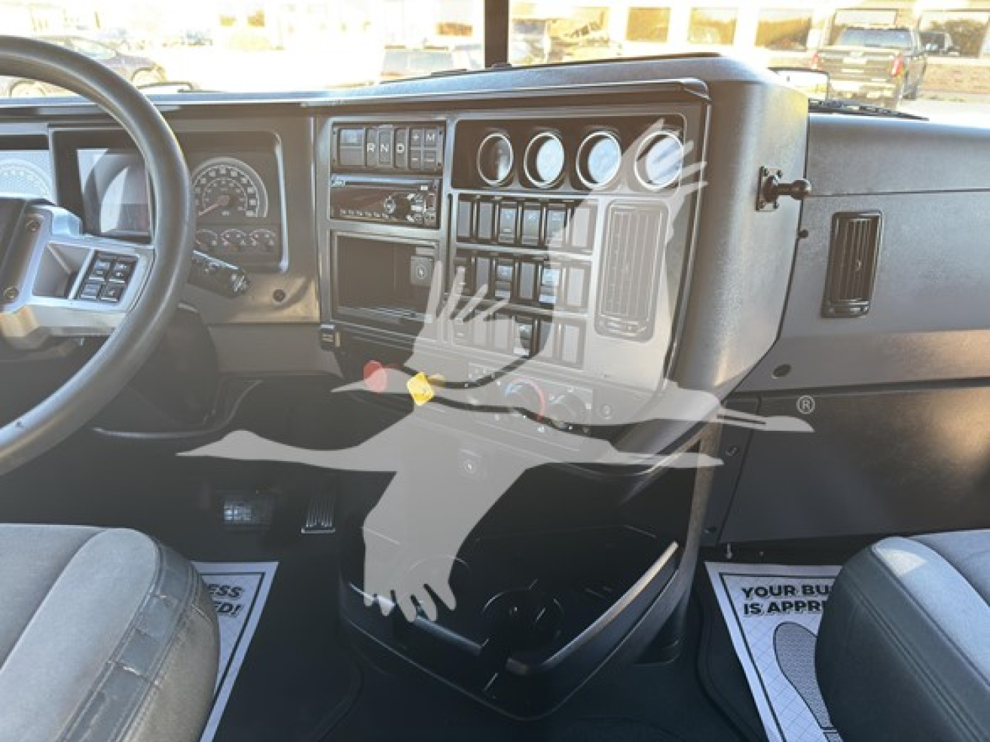 Cab interior of a 2019 Mack Anthem 64T showing dashboard gauges and steering wheel.