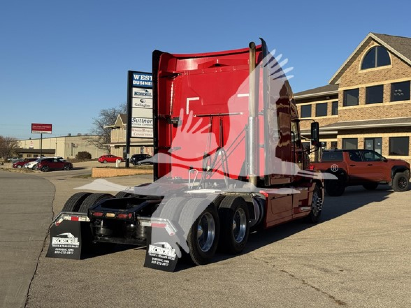 Truck fuel economy 2019 Mack Anthem 64T sleeper tractor rear chassis and red cab, dual rear axles, showing fifth wheel and mudflaps.