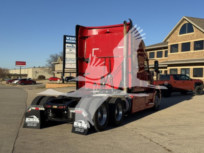 Truck fuel economy 2019 Mack Anthem 64T sleeper tractor rear chassis and red cab, dual rear axles, showing fifth wheel and mudflaps.