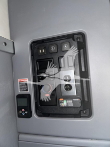 Panel of a 2019 Mack Anthem sleeper cab showing control switches and gauges in a recessed enclosure.