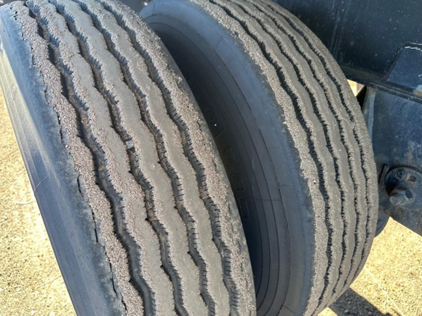 Trailer axle tires showing tread pattern on dual rear wheels of a Fontaine Infinity 48' combo flatbed.