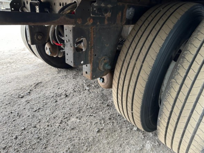 Trailer axle and dual tires view showing rear suspension and frame undercarriage of a 2018 Utility 4000Dx trailer.