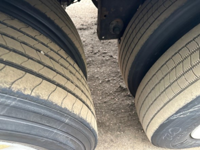 Trailer dual rear tires in view showing tread and sidewalls; part of a used 2018 Utility 4000Dx trailer undercarriage visible.