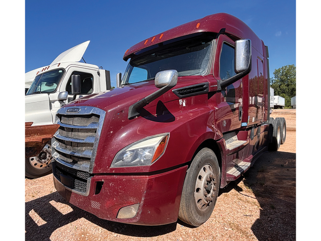 Freightliner Cascadia126 sleeper cab truck in maroon showing front and side view with chrome grille and side mirrors.