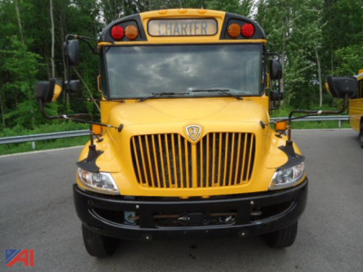 Front view of a yellow 2011 IC Corporation CE Series school bus showing grille, headlights, bumper, wipers, and CHARTER sign on top.