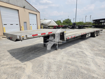 Trailer: 2024 Wabash drop deck trailer showing long flatbed with dual rear axles and center deck support; VIN 1JJG532AXRC446571 stock 7756.