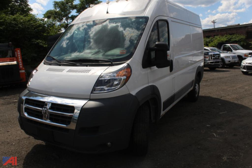 Ram ProMaster full-size cargo van in-service showing front grille and side door with no visible branding text.