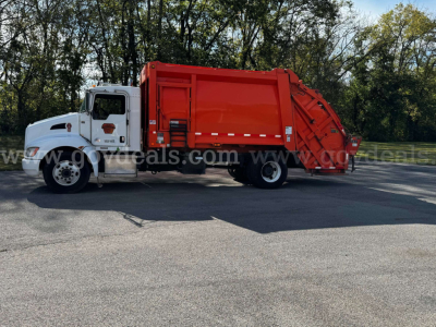 Kenworth T370 garbage truck with white cab and red rear compactor, side view.