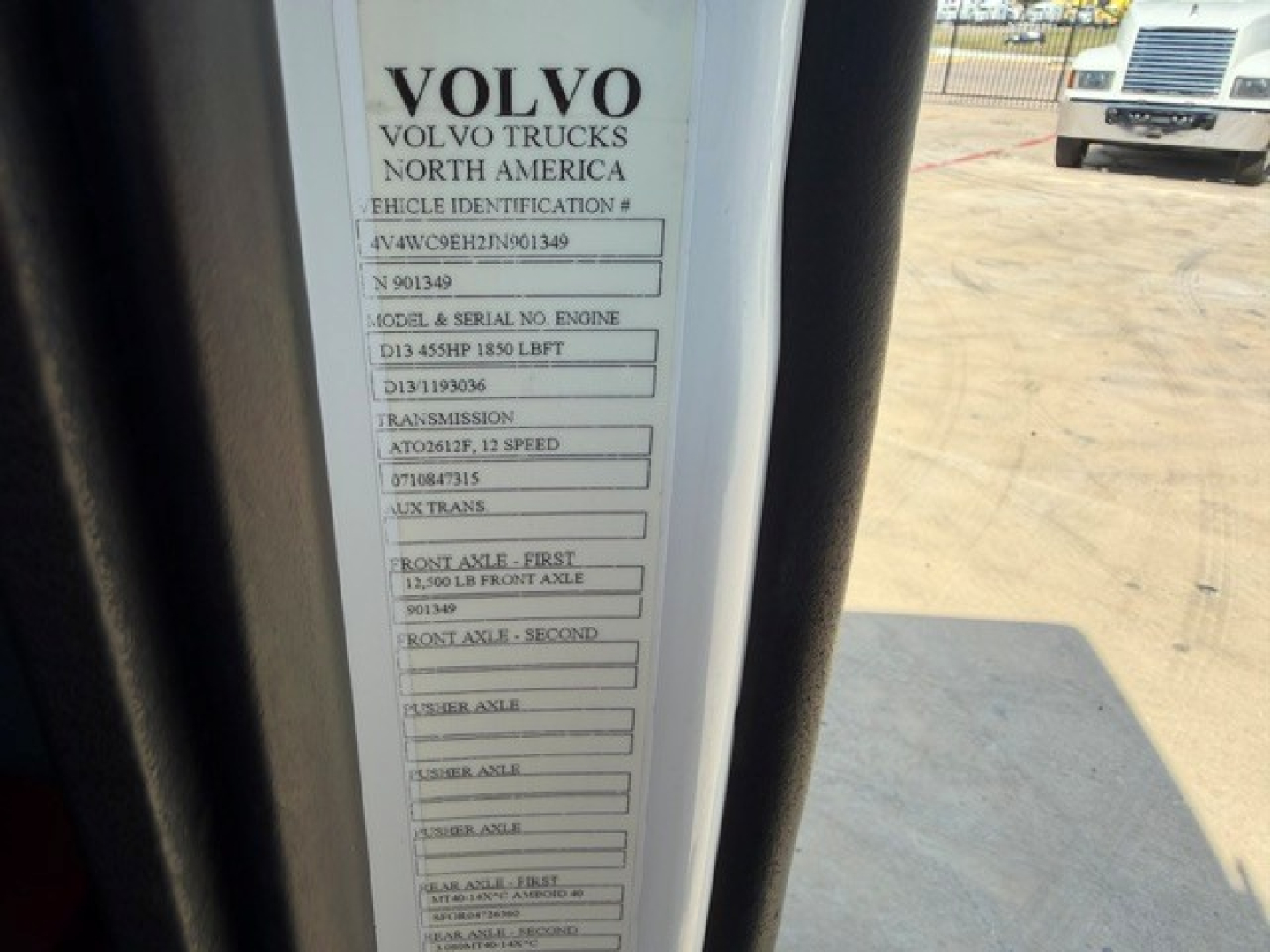 Volvo North America vehicle identification label with VIN 4V4WC9EH2JN901349 and various model details mounted on the door jamb of a Volvo truck.
