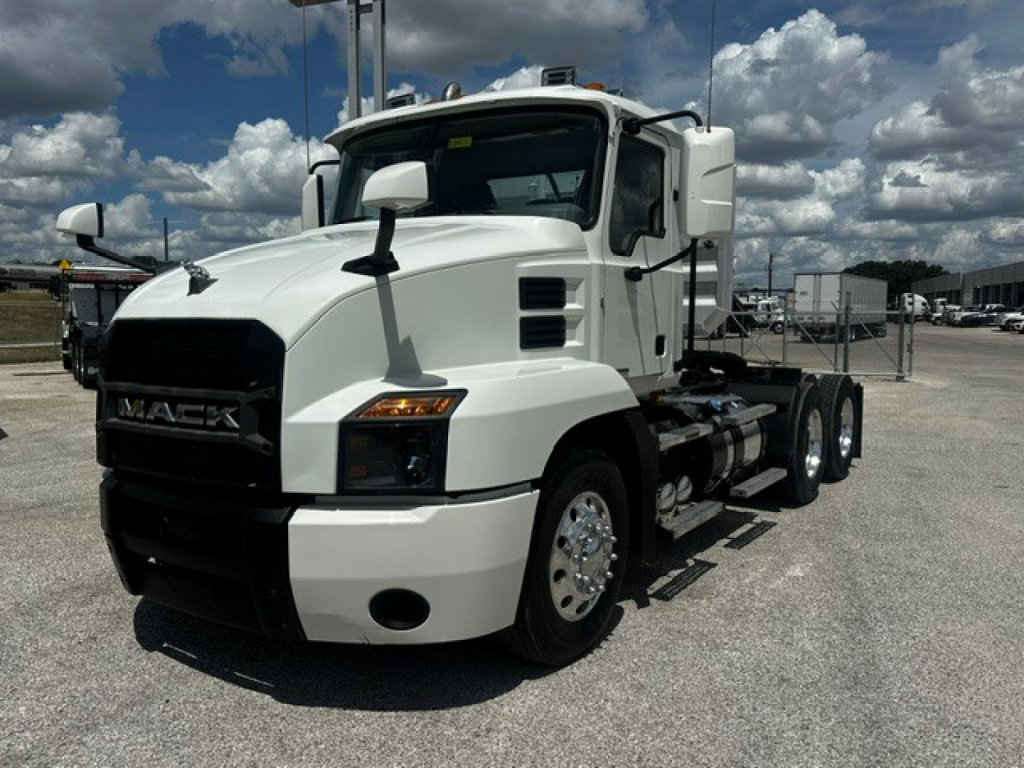 Truck front-left view of a white 2019 Mack Anthem conventional daycab. Visible text includes MACK on grille; side mirrors; cab and chassis with dual rear axles.