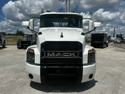 Front view of a white 2019 Mack Anthem truck showing the large black grille with MADK letters, rectangular headlights, and sturdy bumper.