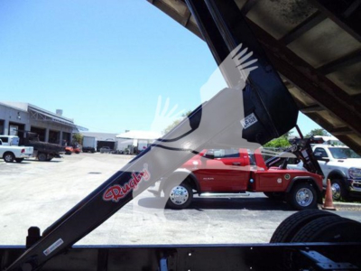 Truck body and chute of an International Durastar 4300 with a chipper attachment visible.