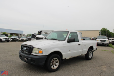 2006 Ford Ranger pickup truck in a used lot, white extended cab 2WD with black front bumper and wheels visible.
