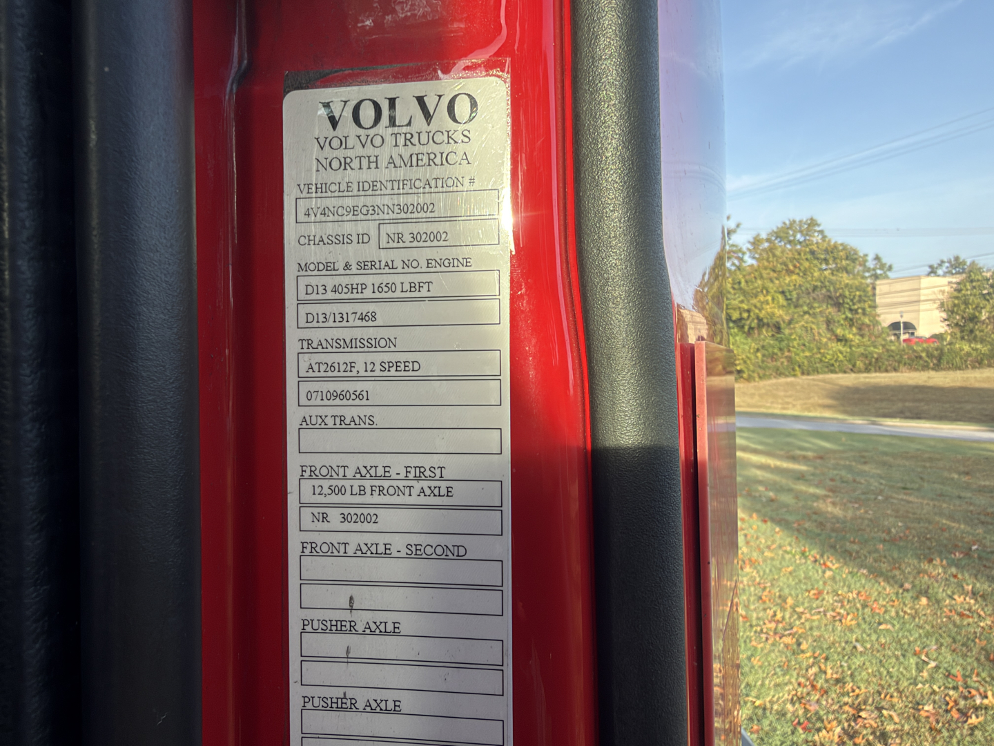 Volvo truck door sticker showing model and engine details including D13 435HP 1650 LBFT, front axle 12,500 LB, transmission lists IShift? and auxiliary transmission info.