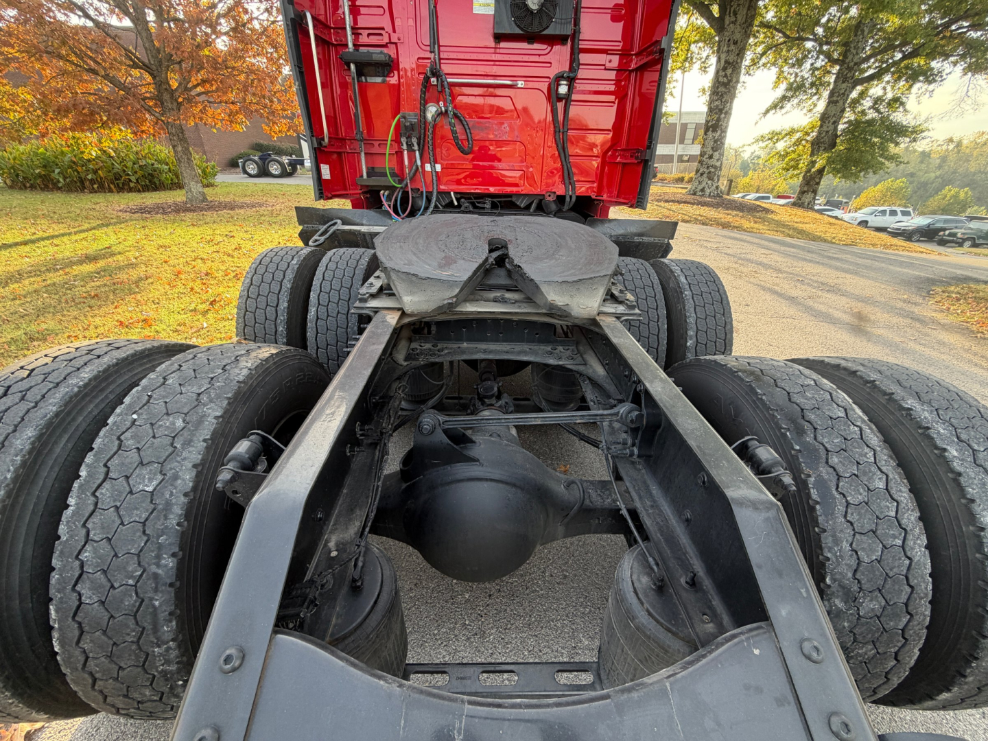 Volvo VNL64T760 tractor rear undercarriage showing dual rear axles and fifth wheel mounting with drivetrain components.