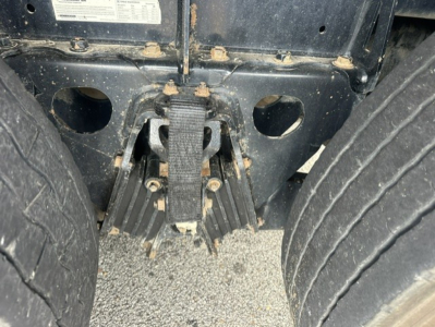 Kenworth T880 rear suspension/air leaf spring assembly with frame and tires visible.