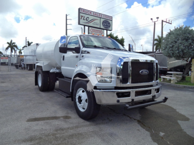 Ford F650 water tanker truck in-service showing front grille, tank, and side mirrors.