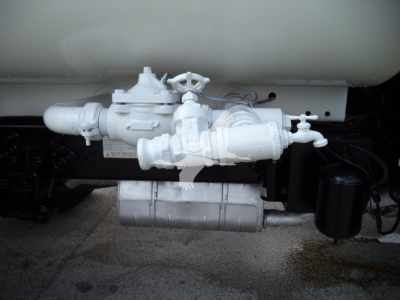 Truck component showing valve, pump, and filter assembly under fuel tank on a 2017 Ford F650 Sd