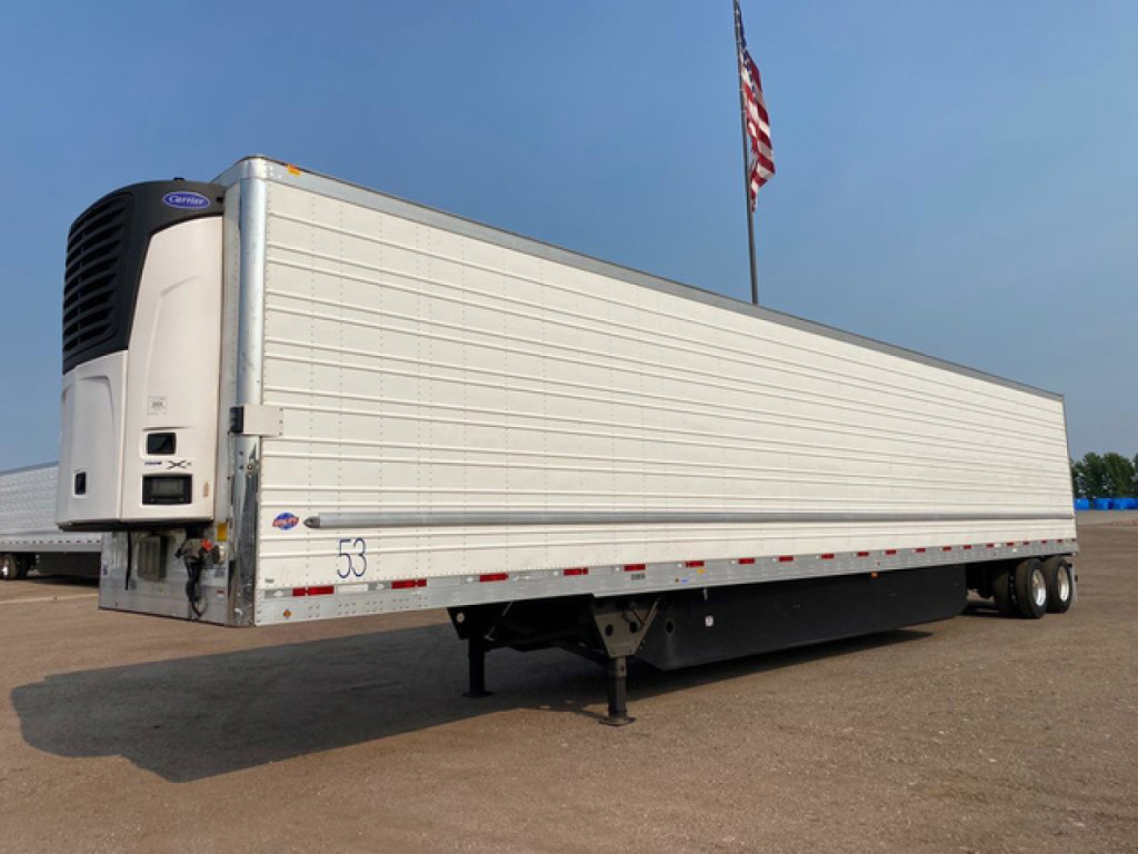 Trailer side view showing refrigerated utility reefer 53-ft with Carrier refrigeration unit at front left and landing gear visible.