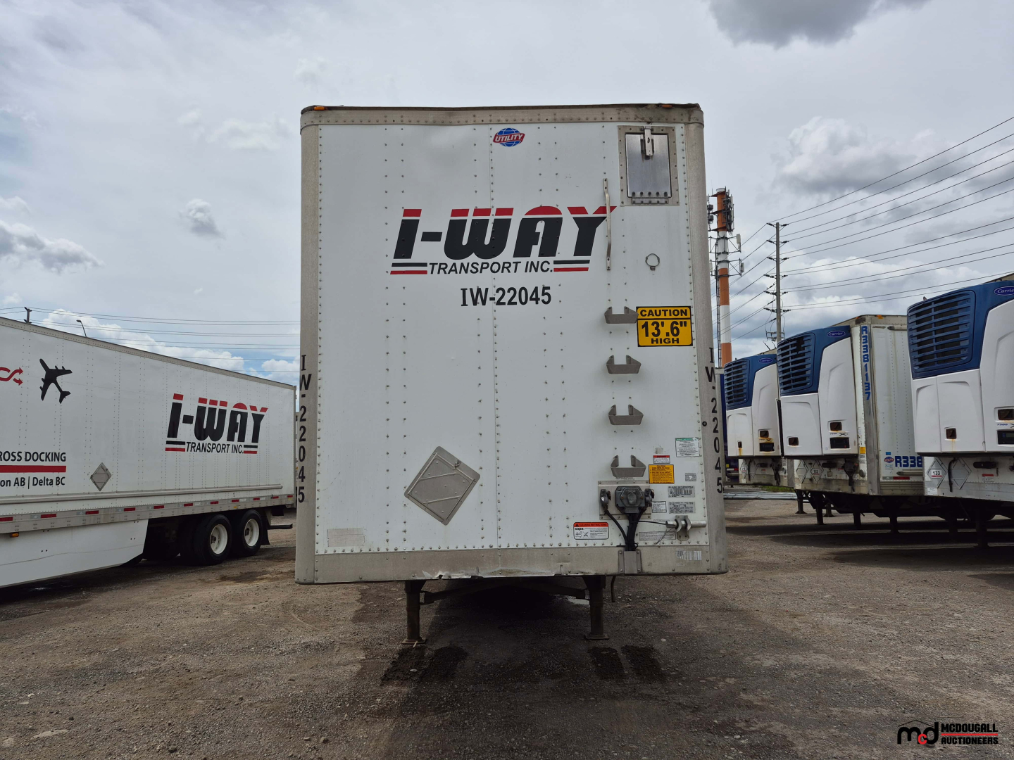 Trailer rear view showing I-Way Transport Inc. branding, DW-22045 code, and safety decals on a 53' dry van trailer.