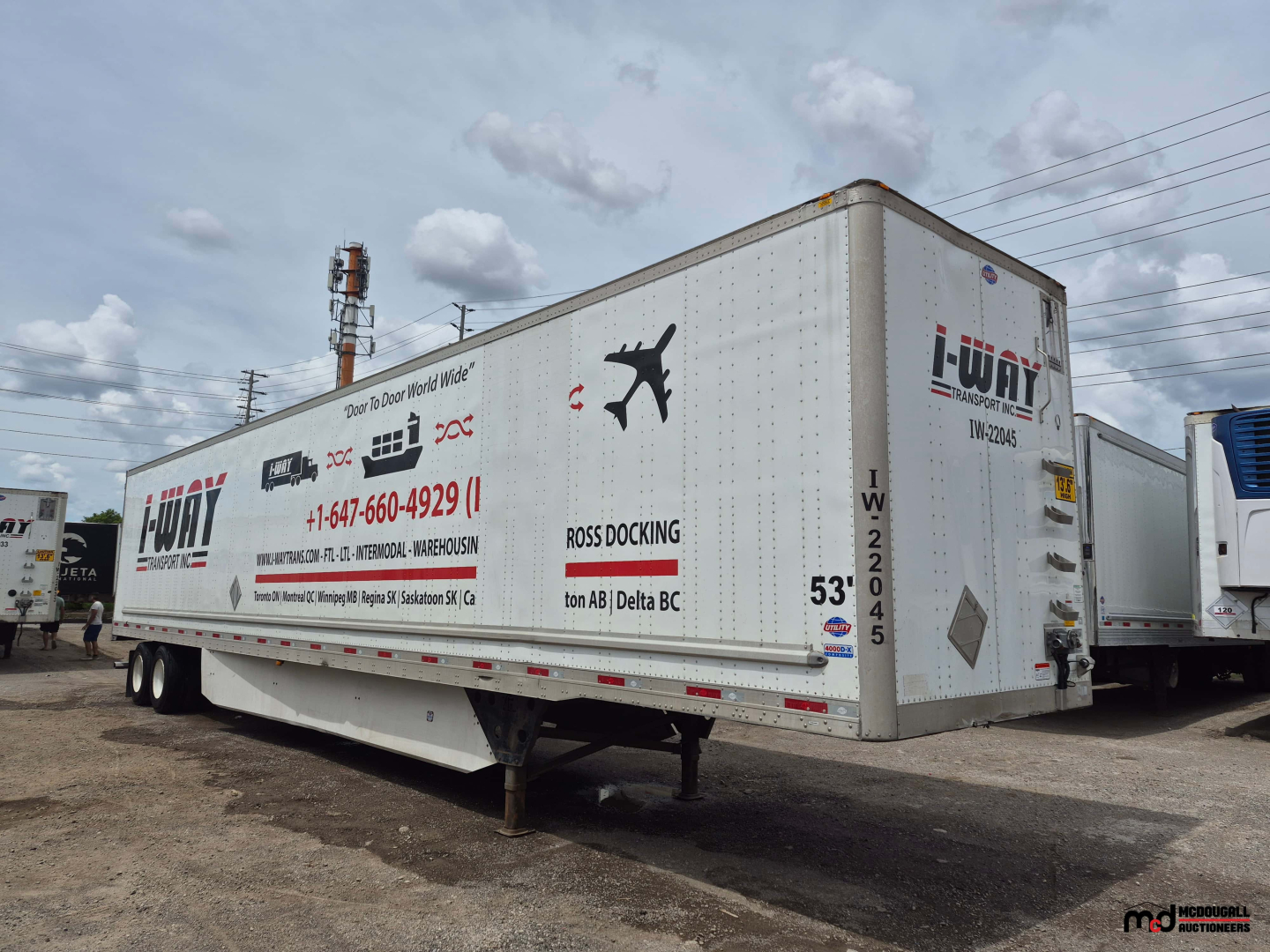 2022 Utility 53' dry van trailer showing I-WAY logo and contact numbers along side with 53' marking and VIN plate.