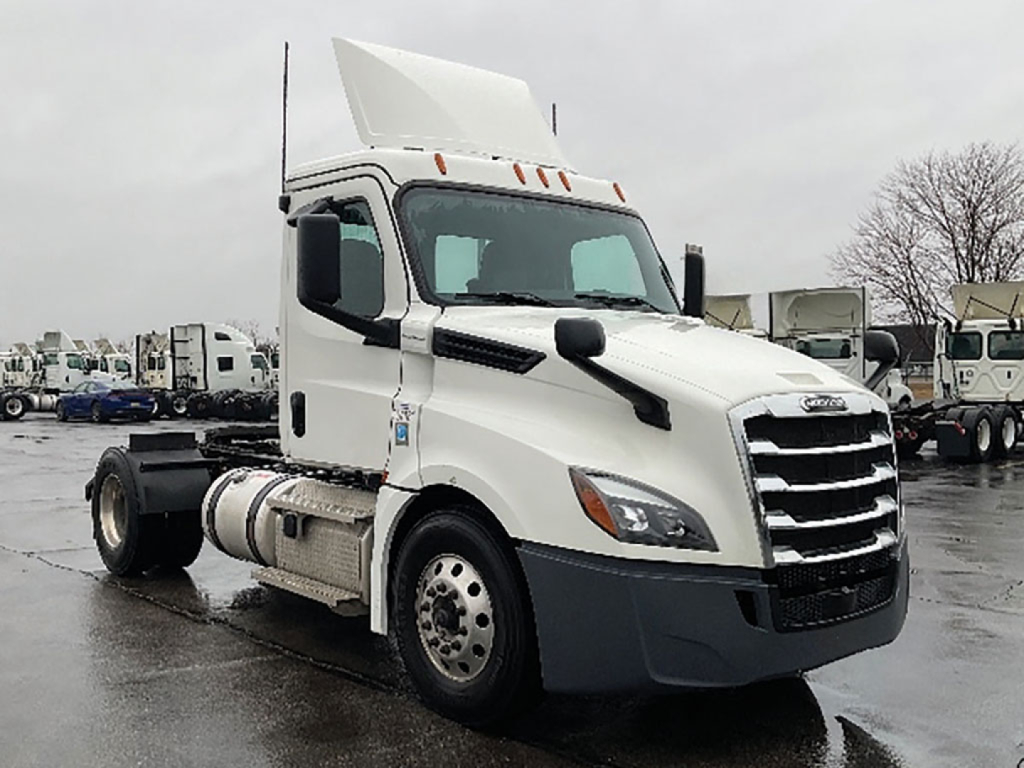 2020 Freightliner Cascadia126 truck cab in white, side view showing cab, grille, and raised sleeper cockpit with open hood top.