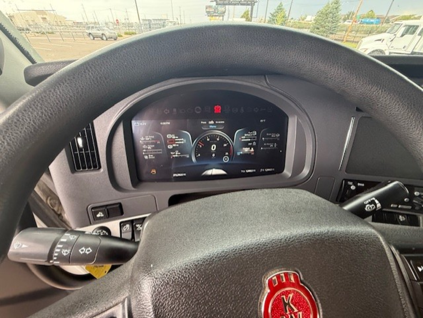 Kenworth T680 dashboard and steering wheel with digital instrument cluster visible