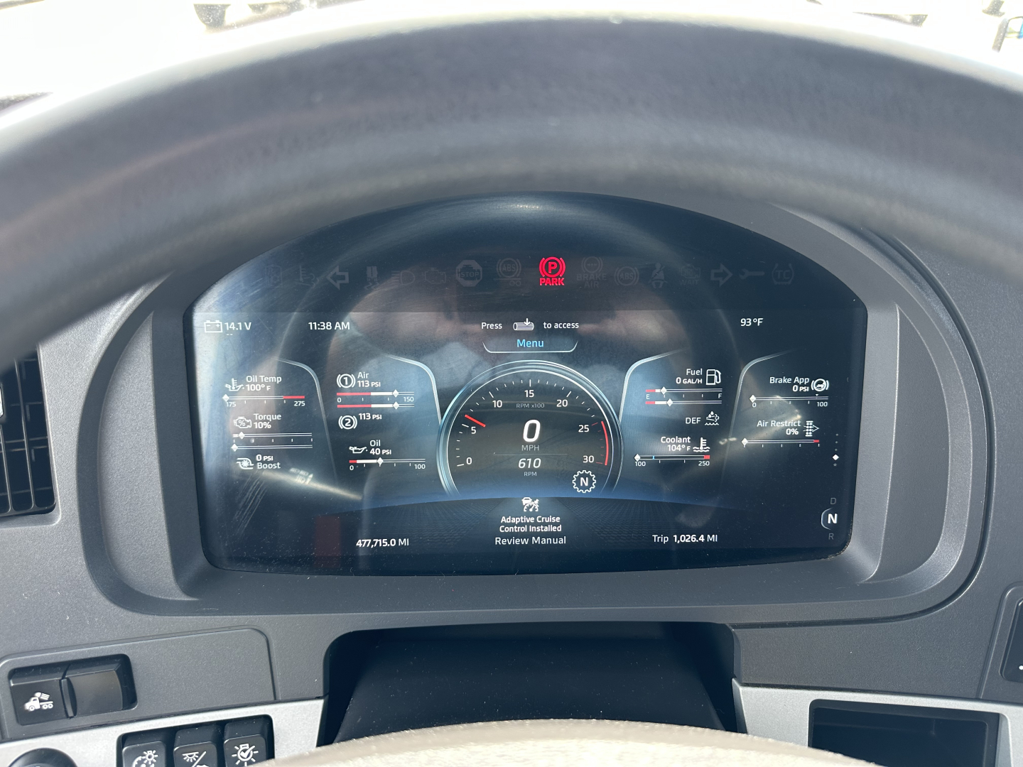 Kenworth T680 dashboard display showing digital gauges and warning icons in the instrument cluster.